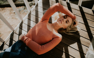 Woman smiling bench blonde denim - a wooden bench free wallpaper