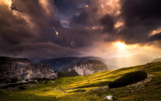 Mountain grassy field cloudy sky 3 - crepuscular ray free wallpaper