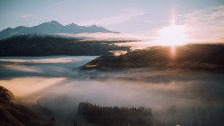 Mountain fog clouds sunset reflection - volumetric fog free wallpaper