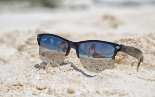 Sunglasses reflection woman beach sand - a pair of sunglasses free wallpaper