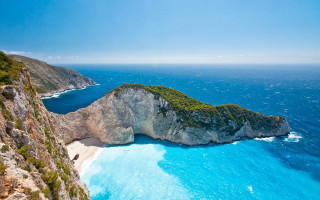 Large rock formation beach cliff - a beach below free wallpaper