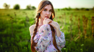 Woman long hair field face - a field of grass free wallpaper