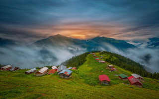 Mountain houses sunset cloudy sky - a matte painting free wallpaper for desktop