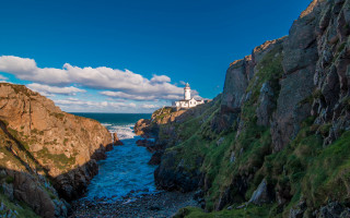 Lighthouse cliff river waterfall fantasy - a lighthouse free wallpaper