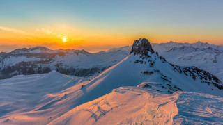 Mountain sunset snow lake city - a sunset in the background free wallpaper