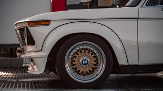 White car brown rim garage - sharp detail free wallpaper