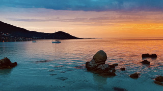 Boat rocky shore sunset mountain - affinity photo free wallpaper