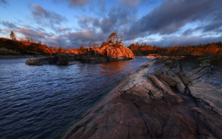 Lake rock outcropping trees dusk - the middle of it free wallpaper