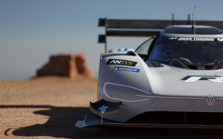 Silver racecar dirtroad rocks sky - silver free wallpaper