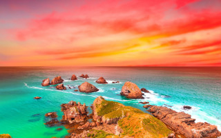 Sunset ocean rocks water red - a red sky above free wallpaper