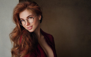 Woman glasses blowing hair portrait - the wind free wallpaper