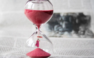 Red sandglass newspaper surreal city - temporary art free wallpaper