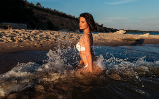 Woman beach splashing water blue - private press free wallpaper