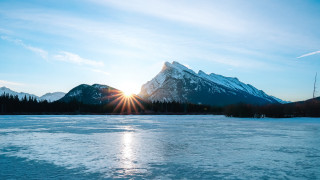 Mountain range frozen lake sunshine - the cloud free wallpaper