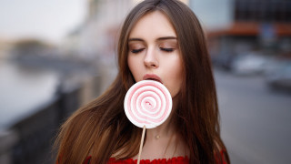 Woman longhair lollipop portrait blurry - long hair holding free wallpaper