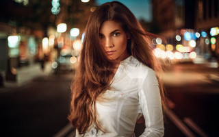 Woman long hair street night - a city street in the background free wallpaper