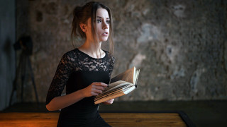 Woman black dress holding book 3 - anka zhuravleva free wallpaper
