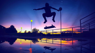 Skateboarder jumping sunset reflection graffiti - a skateboard in front free wallpaper
