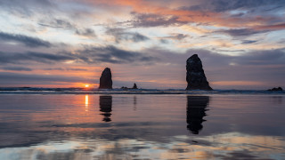 Sunset reflection rock formation beach - the beach in the distance free wallpaper