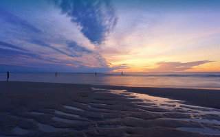 Derold page beach sunset ocean - a few person free wallpaper