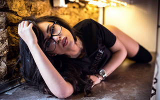 Woman glasses laying blurry cave - glass free wallpaper