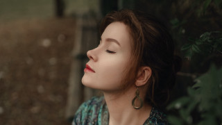 Woman closed eyes upward bokeh - portrait photography free wallpaper