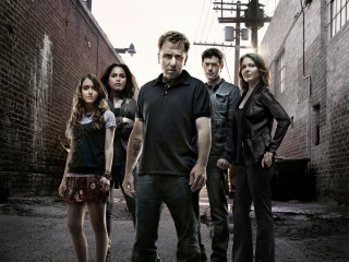 Group people alley brick wall - a brick wall behind them free wallpaper