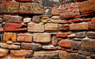 Brick wall small hole middle - andy goldsworthy free wallpaper
