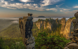 Mountain cliff trees foggy sky - a foggy sky in the background free wallpaper