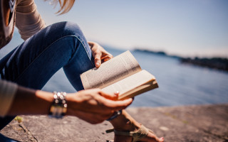Woman reading by water beach - the waters edge free wallpaper