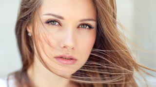Blowing hair portrait brown eyes - shaded free wallpaper