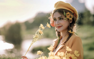 Woman flower hair holding flower - a flower free wallpaper