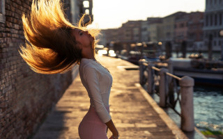 Woman blowing hair river bridge - flowing hair free wallpaper