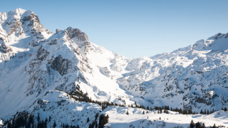 Snowy mountain range blue sky 18 - 4k uhd image free wallpaper