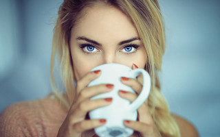 Woman holding white coffee cup - optical free wallpaper