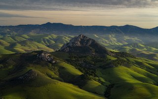 Mountain range green hills cloudy - a few cloud free wallpaper