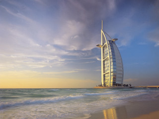 Tall building beach ocean waves - top of a beach next free wallpaper
