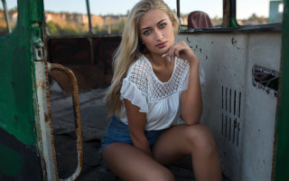 Woman sitting green truck blonde - carla wyzgala free wallpaper