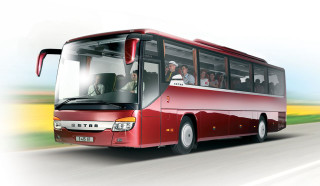 Red bus driving road people - a green field free wallpaper