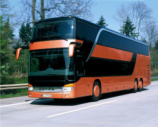 Large orange bus sunny day - tree and a fence free wallpaper