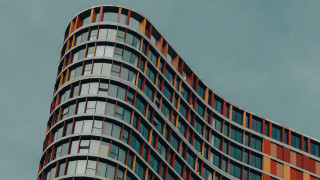 Tall curved building abstract sculpture - bold free wallpaper