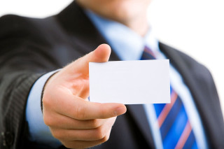 Man suit business card smiling - a man in a suit holding free wallpaper