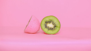 Kiwi slice pink background pink - food photography free wallpaper