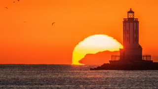 Lighthouse island ocean sunset bird - a small island in the middle of the ocean free wallpaper