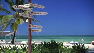 Beach signs pole boats water - a pole free wallpaper