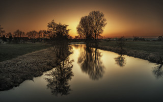 River sunset trees grass reflection - a grassy field free wallpaper