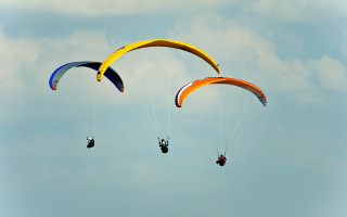 Parasailing two people sky clouds - two person free wallpaper