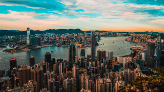 City skyline mountain water beach - the foreground and a mountain range in the background free wallpaper