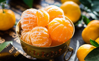 Bowl oranges table book leaves - photorealism free wallpaper