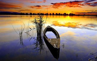 Canoe sunset reflection sky water - a canoe free wallpaper